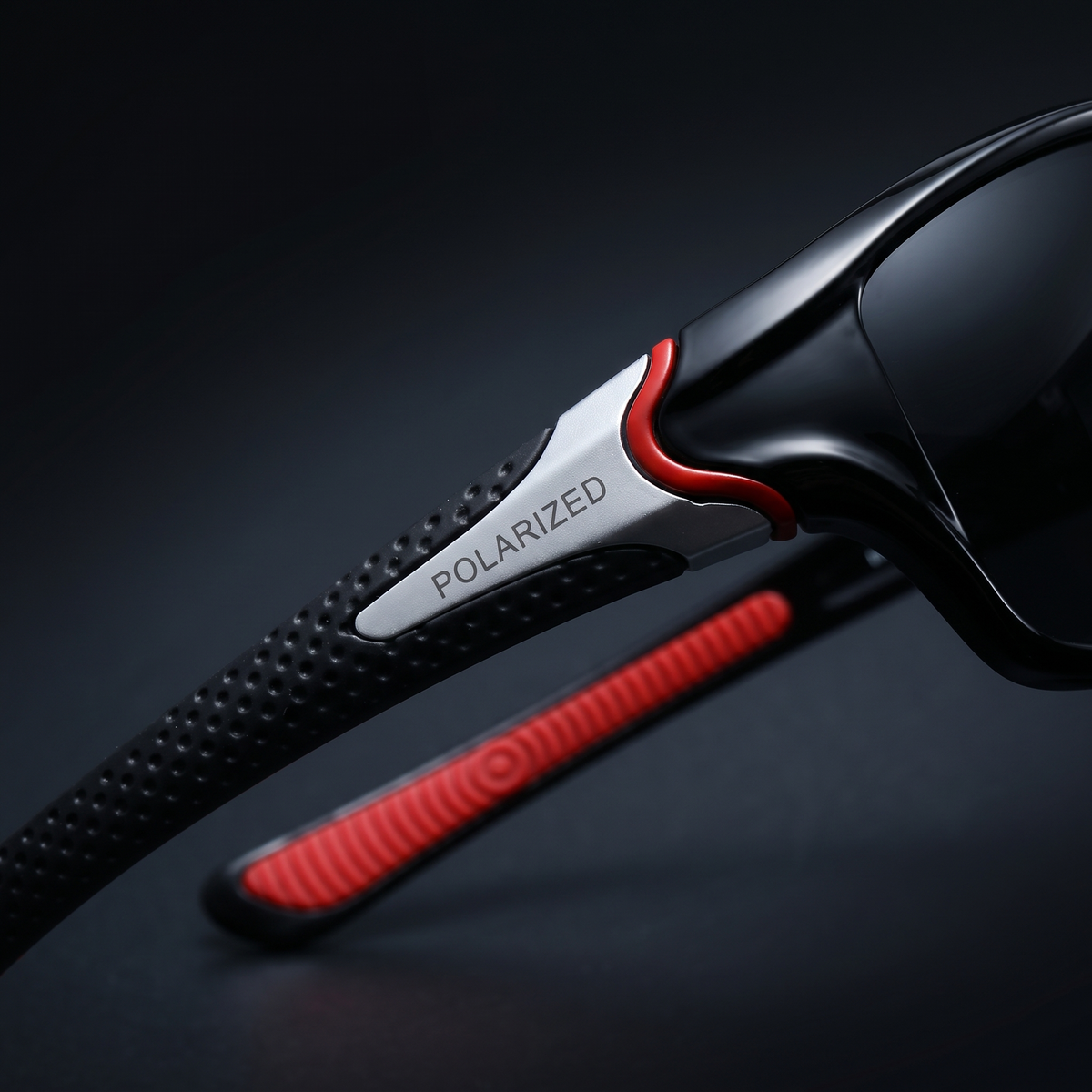 Temple close-up with the POLARIZED badge and rubber grip